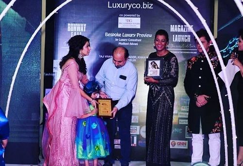 Lavishka Gupta receiving an award