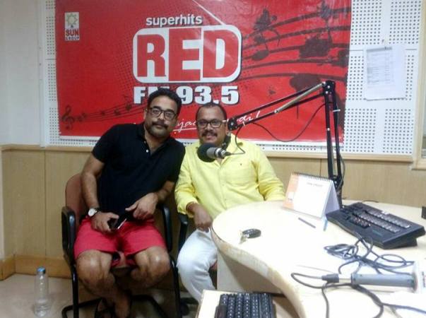 Naveen D. Padil (right) while promoting his film Kudla Cafe at the Red FM Mangalore studio in Mangalore, Karnataka