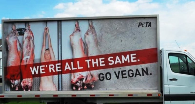 PETA's campaign banner featuring Ingrid Newkirk naked protesting the consumption of meat