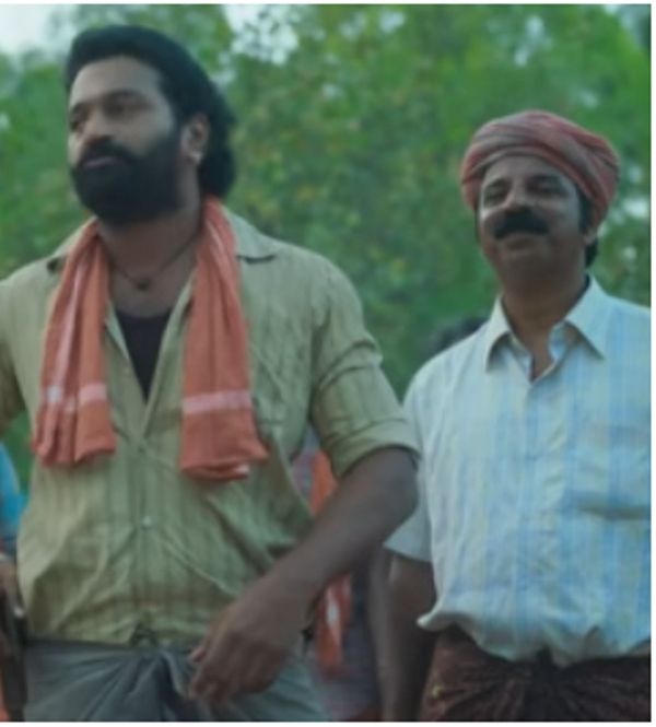 Prakash Thuminad (right) in a still from the film 'Kantara'