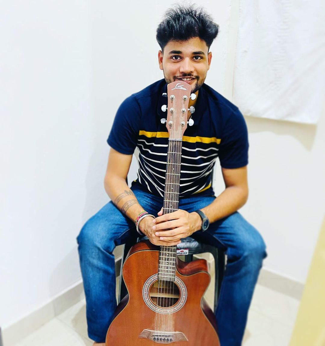 Pushkar Sharma with a Guitar