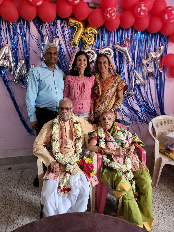 Srabani Nanda (standing, in pink) with her parents and grandparents