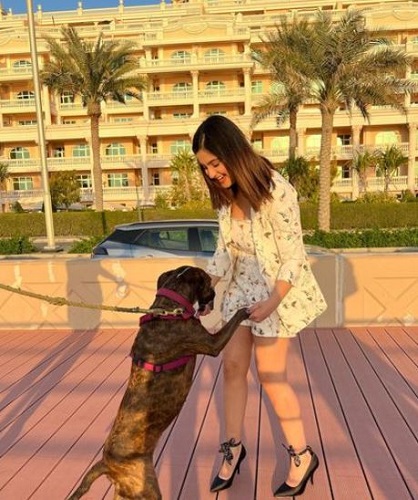 Tunisha Sharma playing with a dog