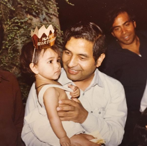 A childhood photo of Sana Amanat with her father