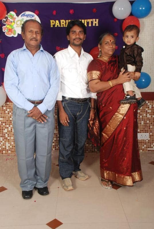 A photo of Prem Rakshith with his parents during his son's birthday