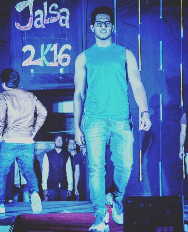 A picture of Swapnil Suryawanshi during his ramp walk at a college fest in 2016