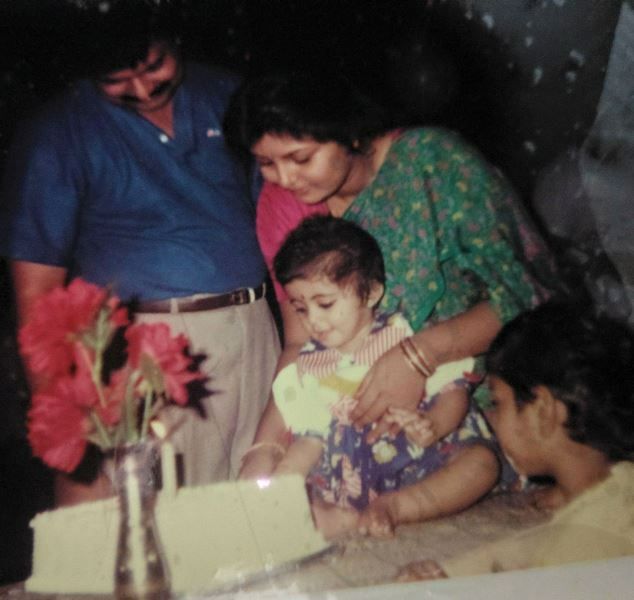 A young Leona Lishoy celebrating her first birthday with her family