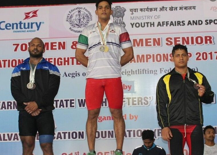Ajay Singh (in centre) after winning gold in the 70th Men Senior National Weightlifting Championships in 2018