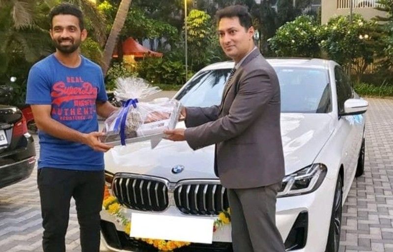 Ajinkya Rahane (left) taking the delivery of his BMW 6 Series Gran Turismo