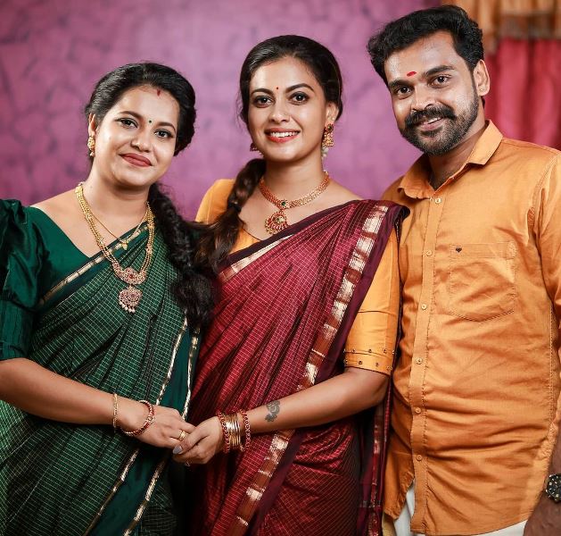 Anusree with her brother and his wife