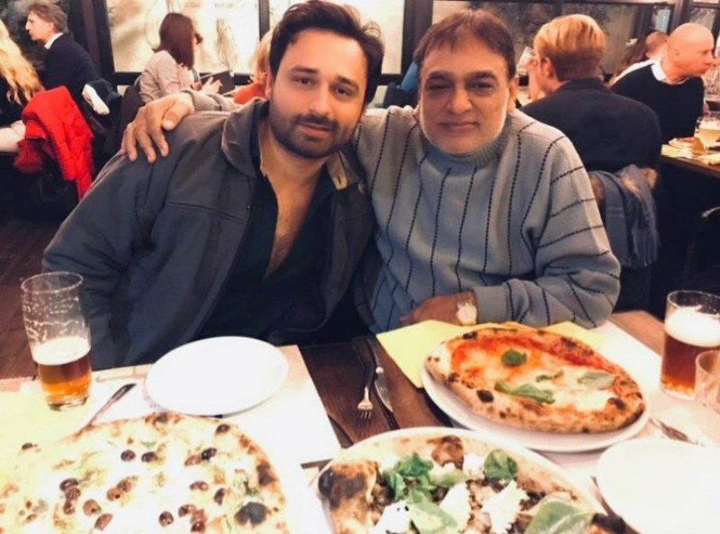 Jaey Gajera enjoying food and beer along with his father, Babulal Gajera, in Rome, Italy