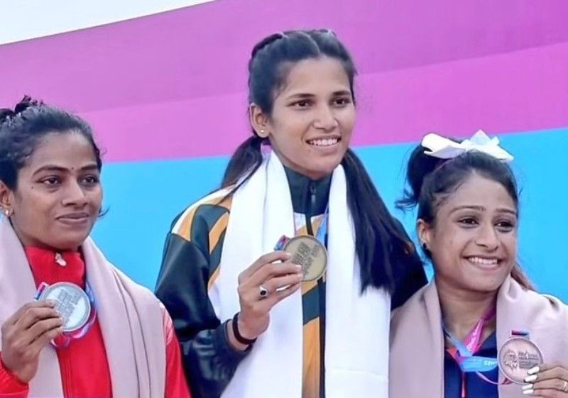 Jyothi Yarraji (centre) after winning gold in the 36th National Games
