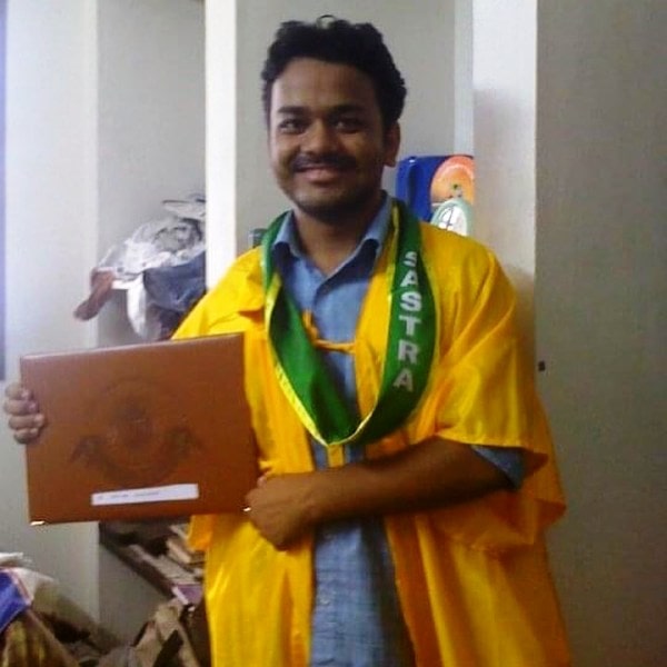 Kumar Varun holding his engineering degree