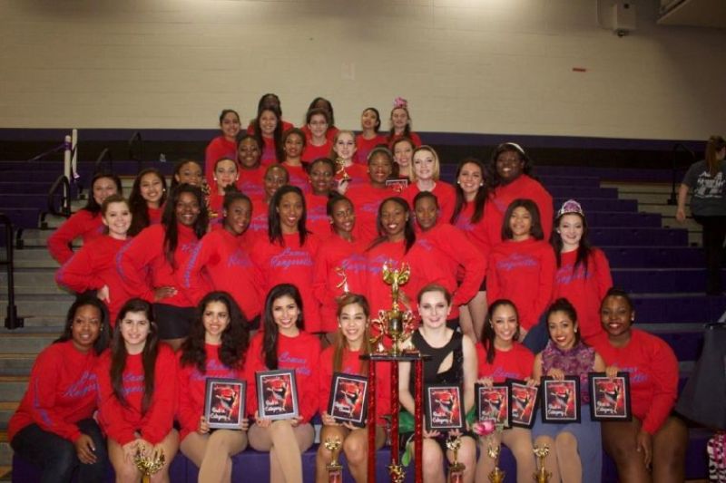 Liza Koshy (front row; sitting second from the right) and The Lamar Rangerettes reigned as Grand Champions at Showtime International Dance Contest