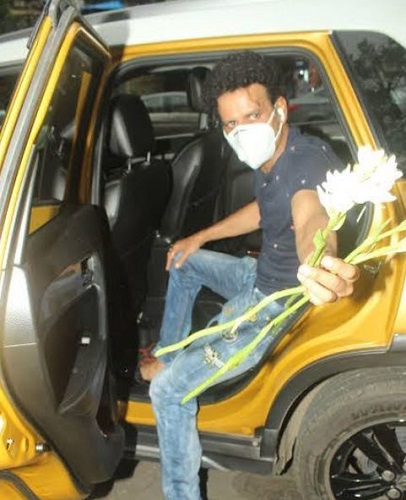 Manoj Bajpayee sitting in his Maruti Suzuki Vitara Brezza car