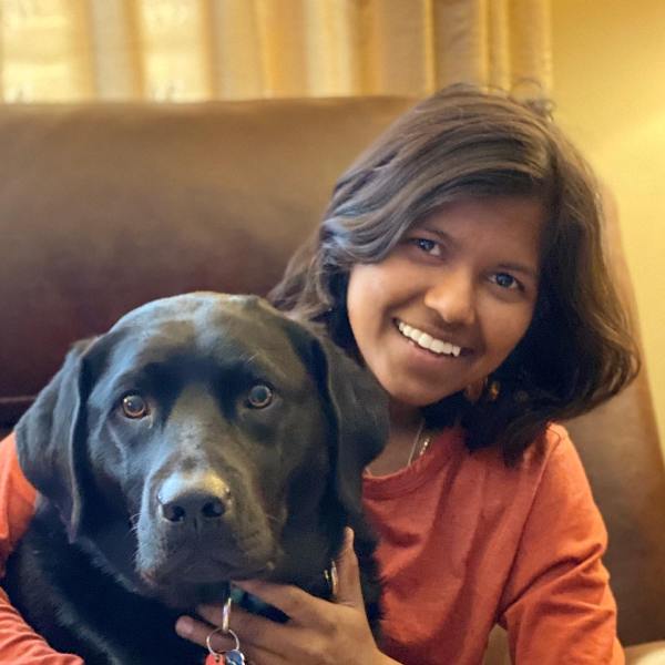Poorna Malavath playing with her dog