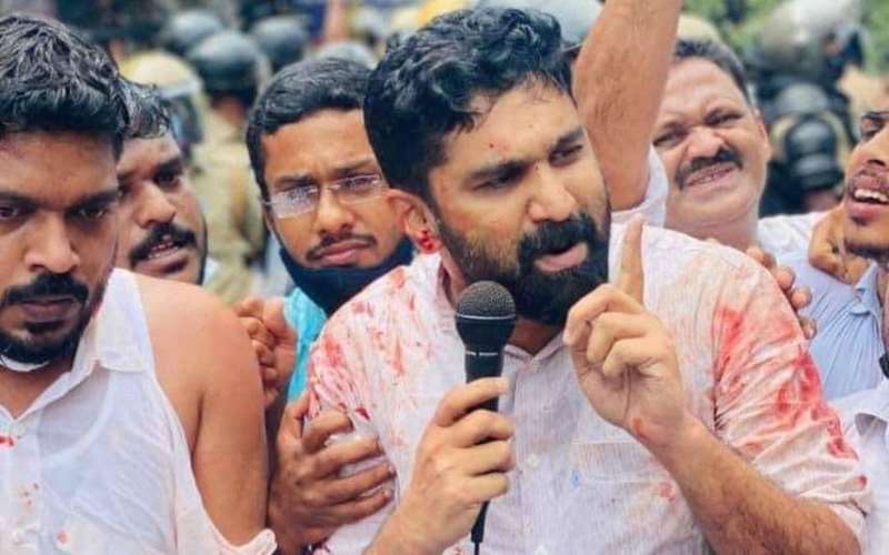 VT Balram addressing a protest after the police resorted to lathi-charge