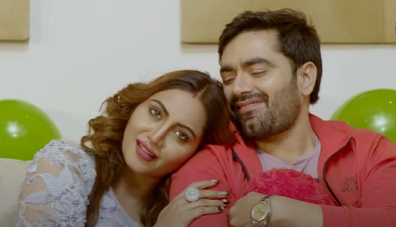 Vicky Kajla with Arshi Khan in a still from the music video Valentine Rose (2019)