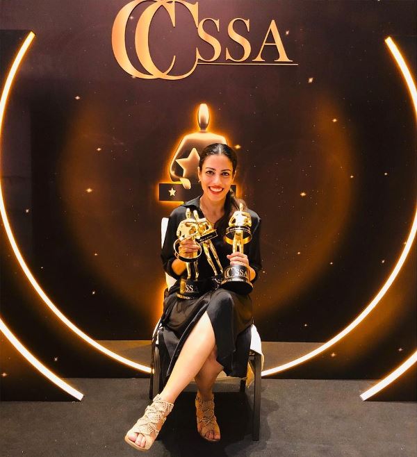 A photograph of Sheetal Menon with her awards at the CCSSA 2019