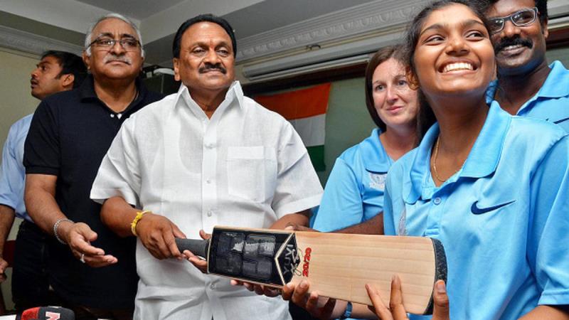 A photograph of Sneha Deepthi being congratulated by ACA officials after she received her international call-up