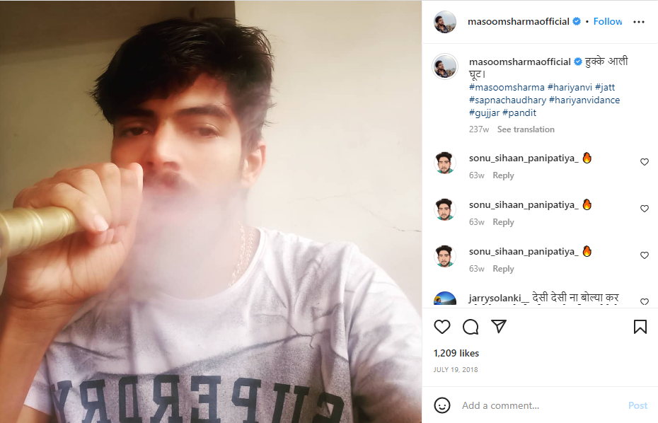 An Instagram post shared by Masoom Sharma, where he is seen smoking hookah