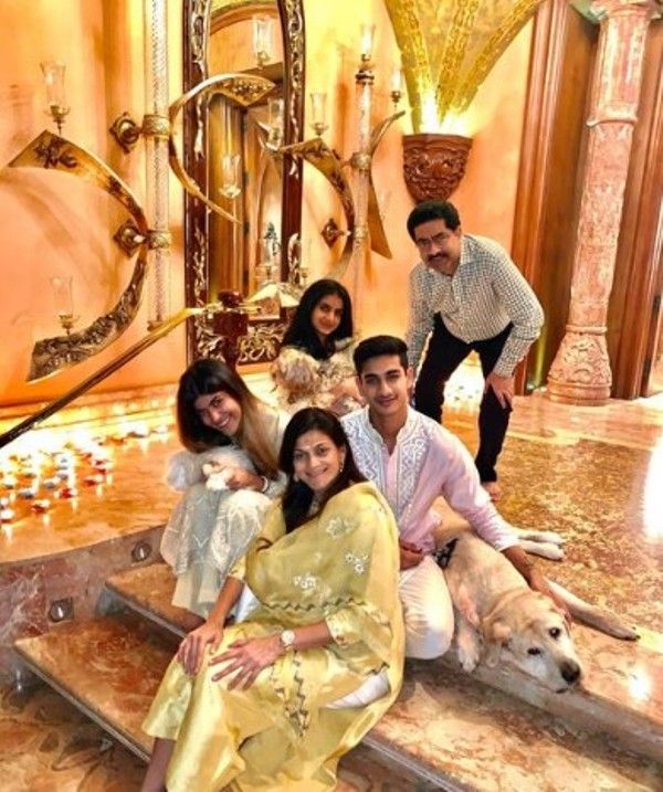 Ananya Birla (left) in a family photograph which also includes her pet dogs