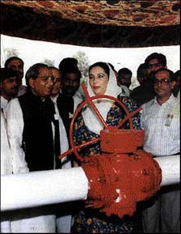 Benazir inaugurating supply of natural gas in a city in Pakistan in 1995