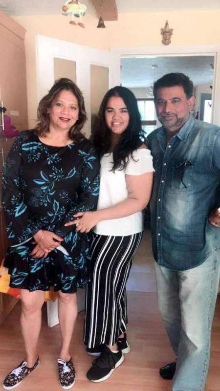 Chetan Sharma with his wife, Ramani (left) and daughter (center)