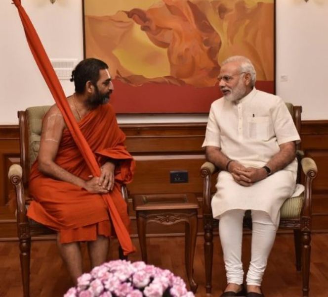Chinna Jeeyar Swamy and Narendra Modi discussing the installation of Ramanuja Charya Swami in Hyderabad