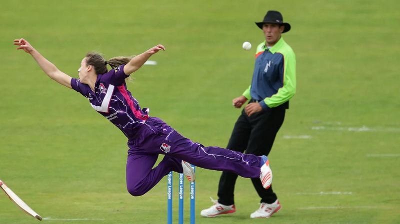 Ellyse Perry as player of Loughborough Lightning, leaping to her right in vain to stop the ball in a match against Yorkshire Diamonds during Women's Cricket Super League (2016)