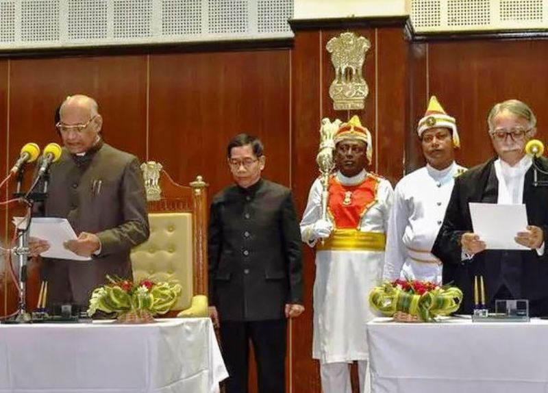 Former Chief Justice of Tripura High Court Sanjoy Koral (right) administering the oath as the 18th Tripura Governor to Ramesh Bais (left) at a Swearing-in Ceremony held in Agartala in 2019