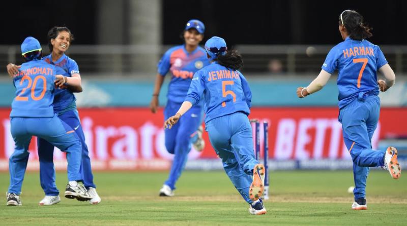 India Women players celebrating the fall of the wicket of an Australian player