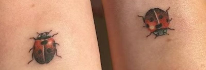 Jess Jonassen and her sister tattooed ladybug on their right wrist
