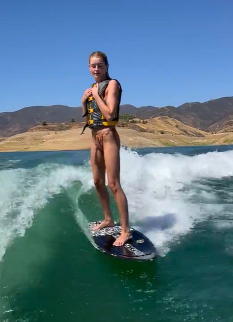 Josie Redmond surfing