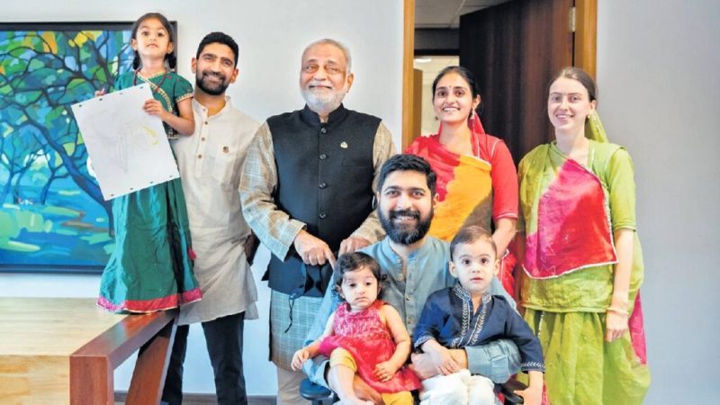 Kamlesh D. Patel with his sons, daughters-in-law, and grandchildren