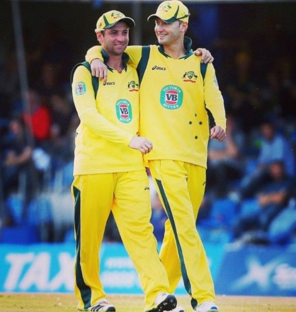Michael Clarke (right) with Philip Hughes