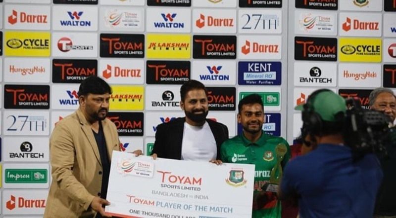 Mohamedali Budhwani giving Toyam Player of the Match Award to a player of Bangladesh Cricket Team