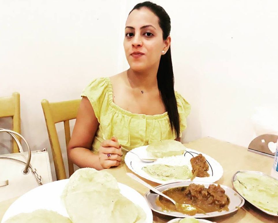 Noor eating non-vegetarian food