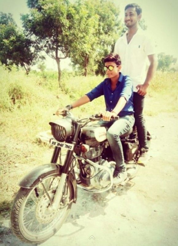 Poonam Khemnar riding a motorcycle