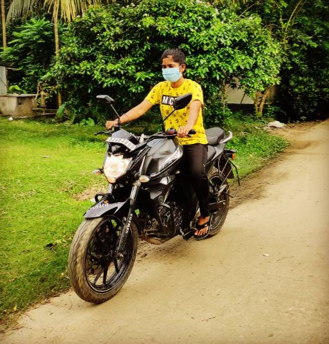 Priyanka Bala riding a bike