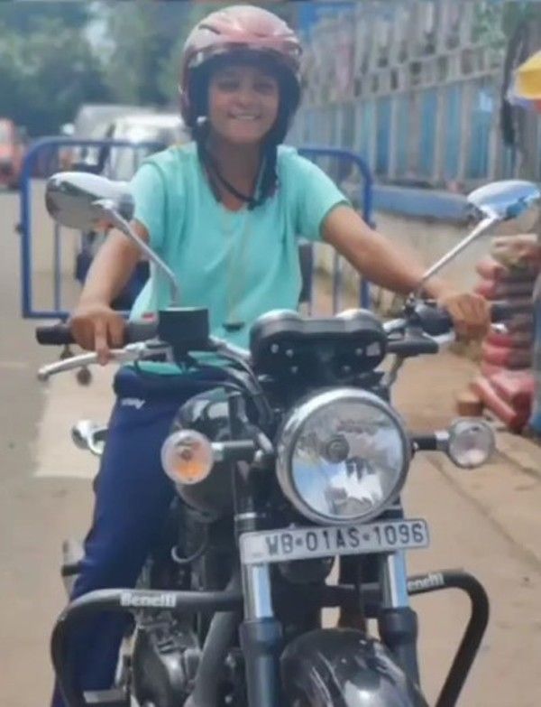 Saika Ishaque driving a motorcycle