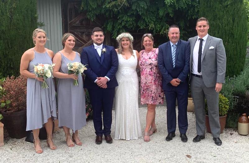Sophie Devine with family at her younger sister's wedding