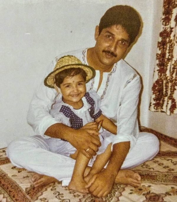 A childhood image of Roshni Bhattacharyya with her father