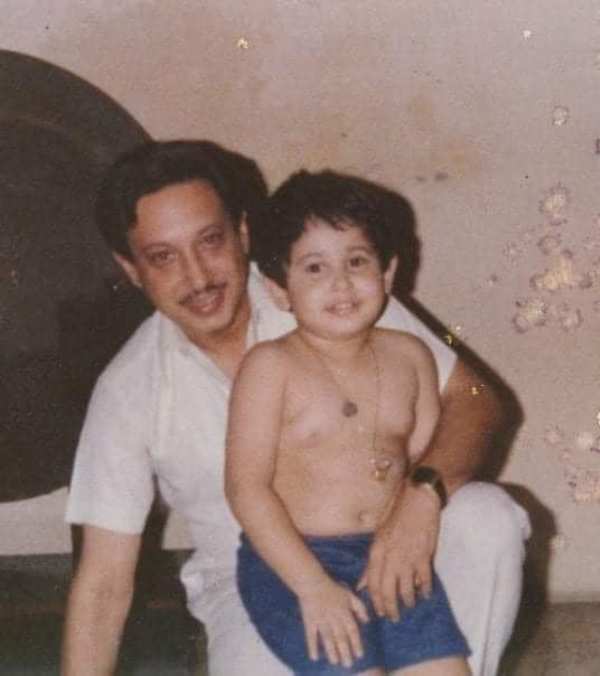 A childhood photo of Pradyot with his father