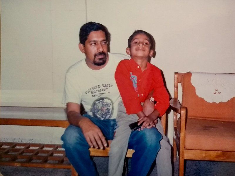 A childhood photograph of Arjun Radhakrishnan with his father