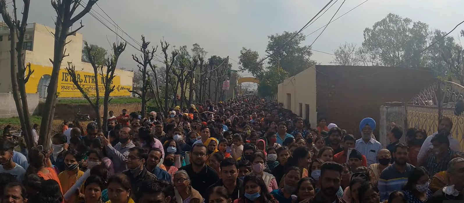 A crowd of devotees outside the Dugri Mandir