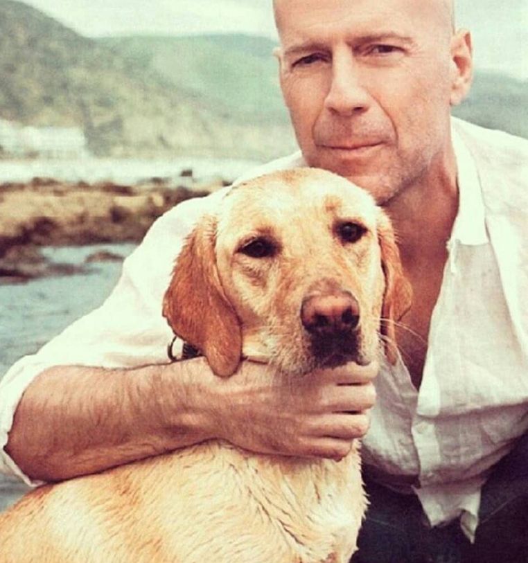 A picture of Bruce with a dog