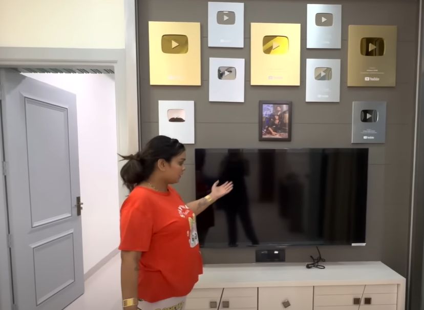 A wall showcasing the YouTube Play Button at the Malik's house
