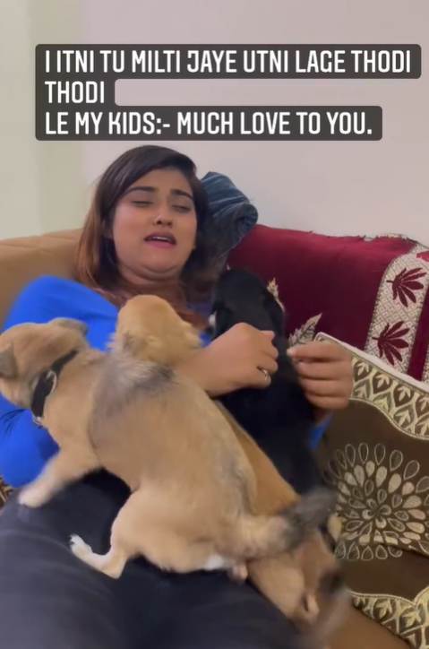 Akanksha Dubey playing with puppies