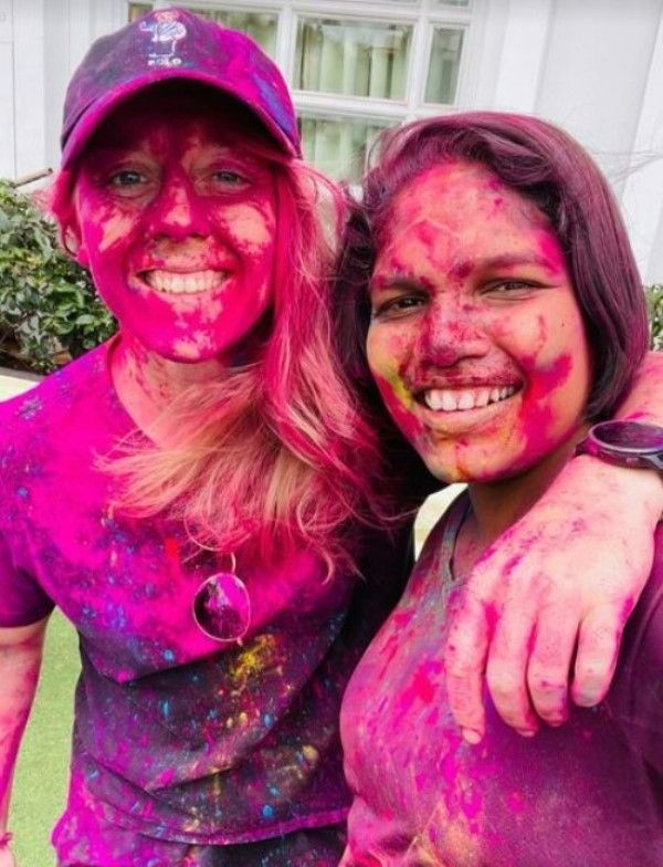 Asha Shobana celebrating Holi with her RCB teammate Heather Knight